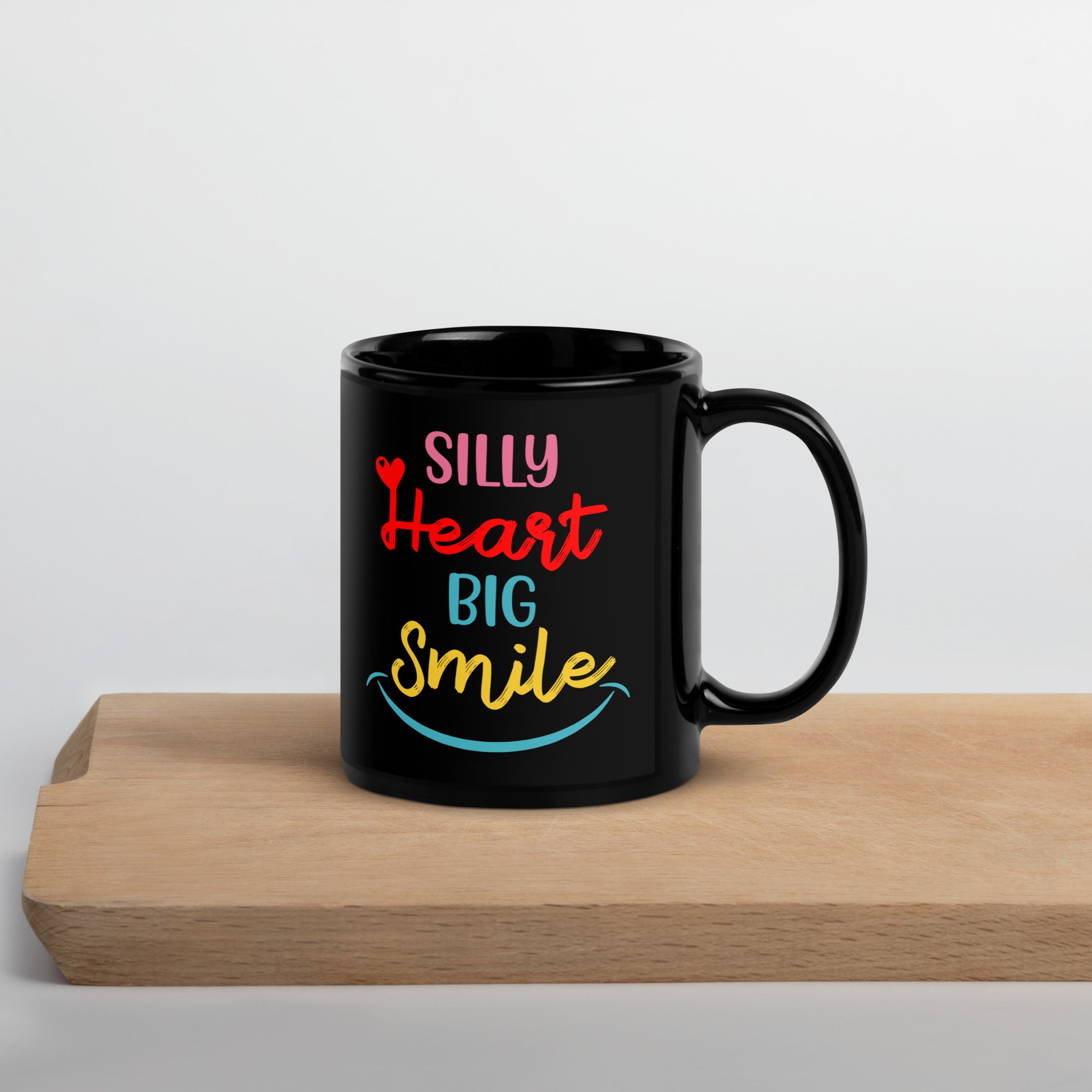 silly-heart-big-smile-black-glossy-mug